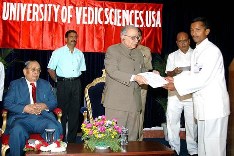 Governor Sri T.N. Chaturvedi awarding the degrees